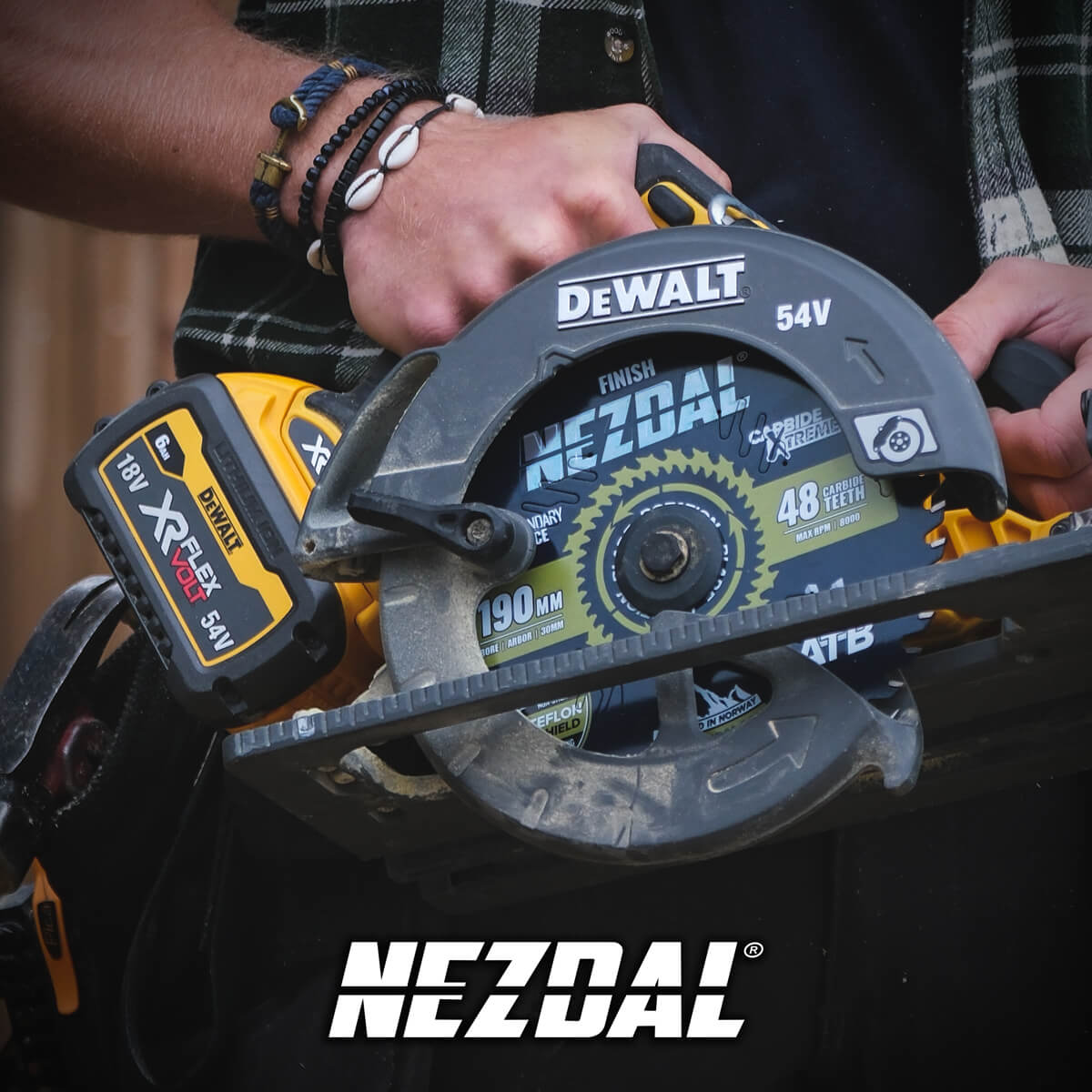 carpenter holding a dewalt circular saw in his hand